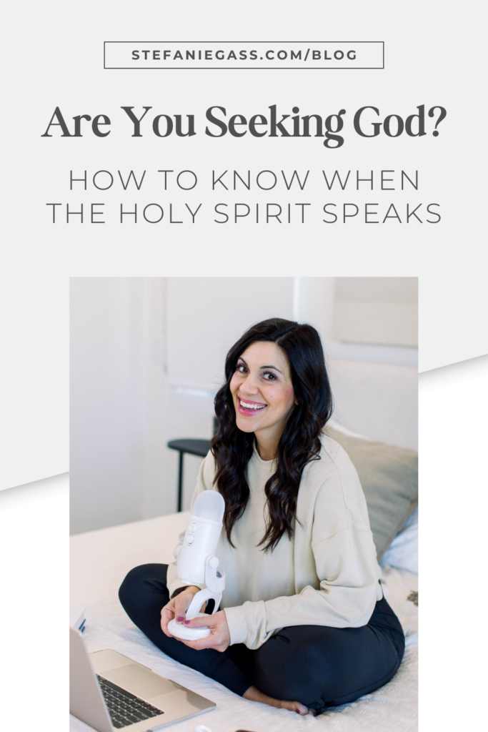 Dark Haired woman sitting in bed holding podcast microphone in front of a laptop. Title: 4 Phases to know if Holy Spirit is Speaking to Your. File name: Know-if-Holy-Spirit-is-Speaking-to-You-Stefanie-Gass