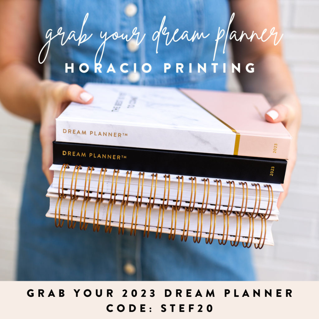 A woman holding four styles of 2023 dream planners from Horacio Printing. horacioprinting.com use code STEF20 to save 20%. stefaniegass.com