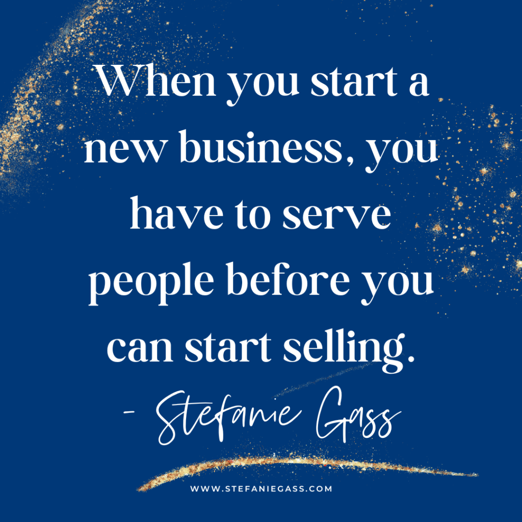 Navy blue and gold splatter background with quote When you start a new business, you have to serve people before you can start selling. -Stefanie Gass