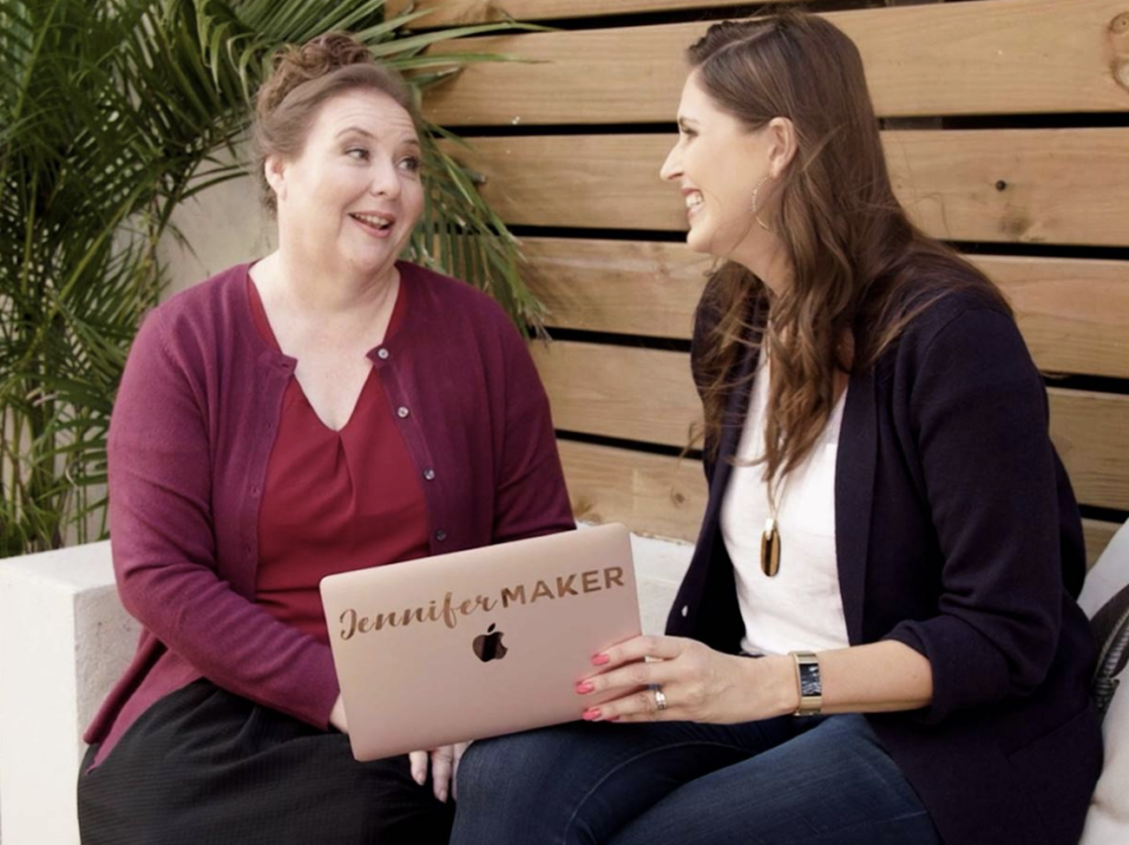 Ruth Soukup talking with a client on a pink laptop in a blog written by Stefanie Gass. 