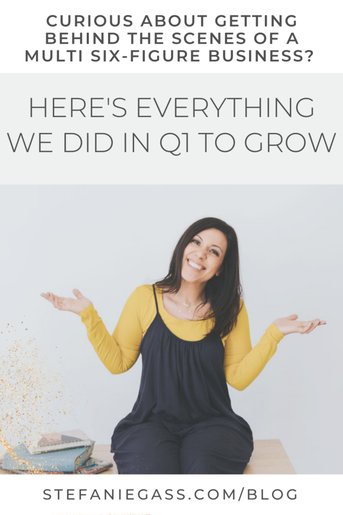 Excited, dark haired woman sitting on her desk. Stefanie Gass blog post about everything we did in Q1 to grow.