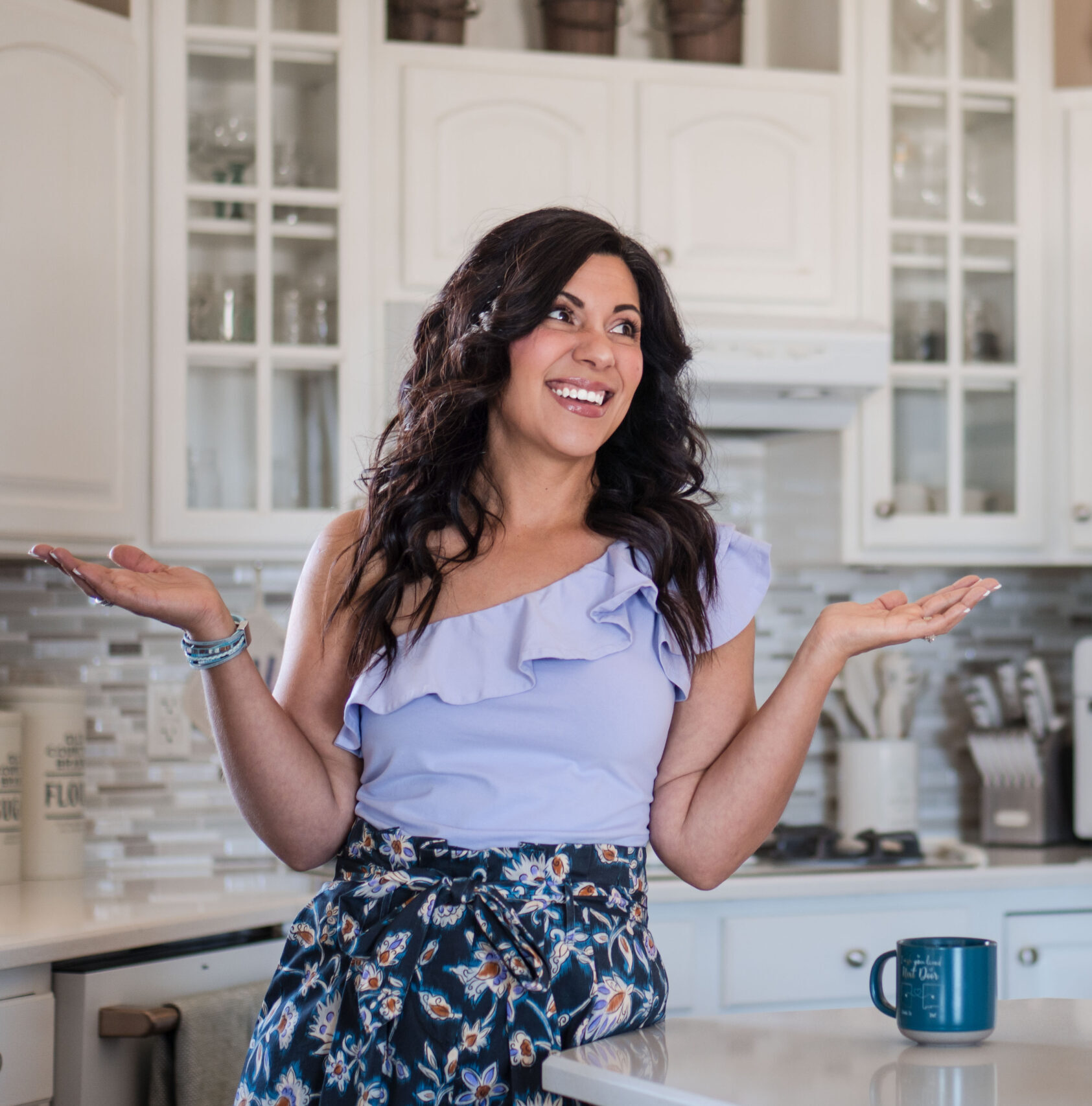 standing-in-kitchen-with-mug-unsure-stefanie-gass The image title is: Ep-630-Let-Talk-About-AI-Am-I-Using-It-Should-You-Use-ChatGPT-For-Your-Podcast-or-Content-Stefanie-Gass