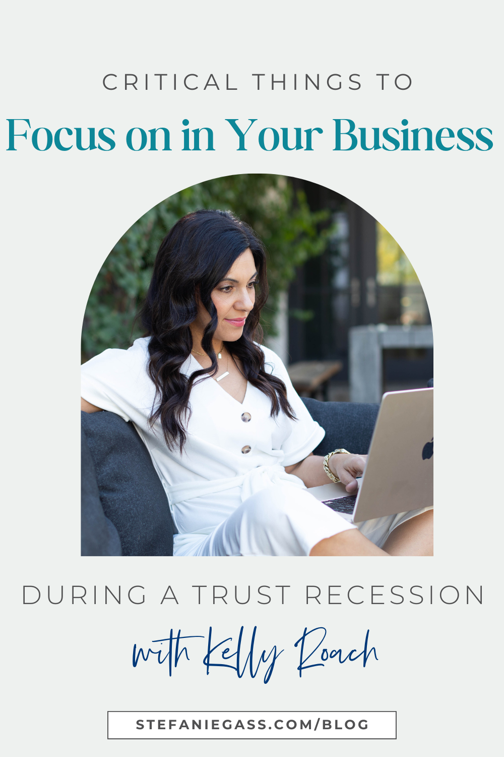 brown haired woman sitting on a blue coach with her laptop in her lap. Image text reads: Critical Things to Focus on in Your Business During a Trust Recession with Kelly Roach, Stefanie Gass Blog