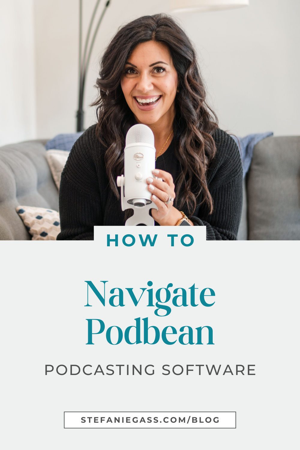 Graphic by Stefanie Gass where she, a dark-haired woman is sitting on a couch, smiling at the camera while holding a Yeti podcast microphone. She's wearing a black sweater. The image title is: How-to-Navigate-Podbean-Podcasting-Software-Stefanie-Gass-Branded