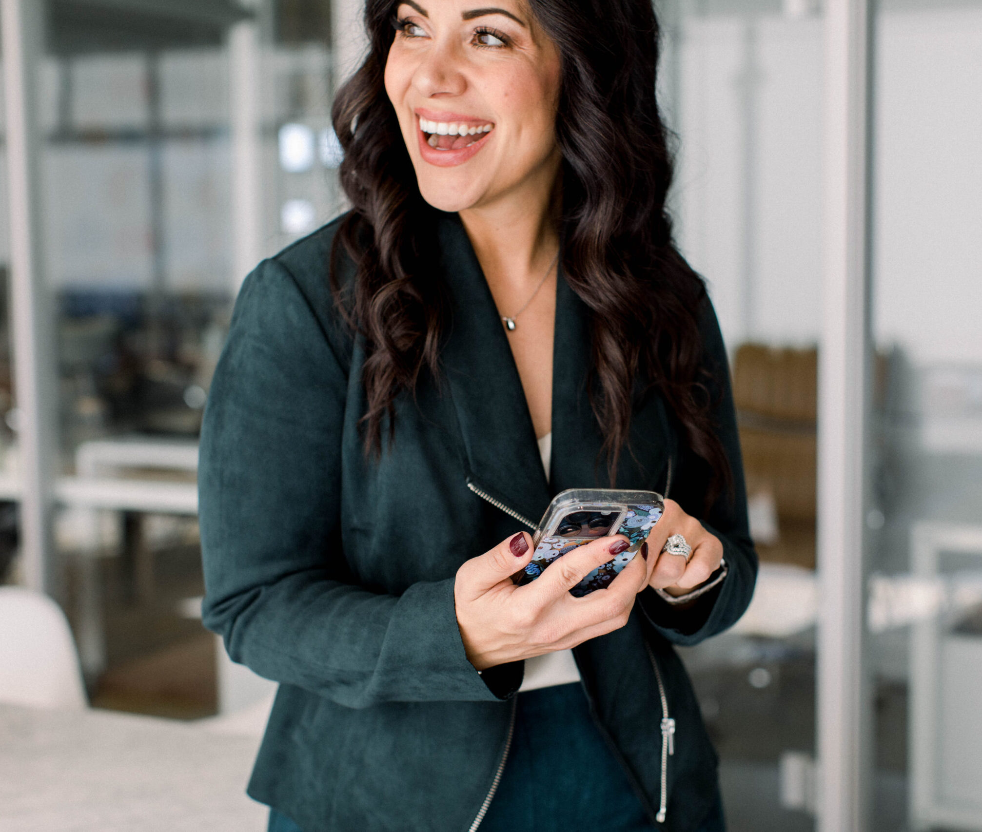 A dark-haired woman is smiling, looking to her side. She's wearing a dark green rich velvet blazer and has her phone in her hands. The image title is: Dream-With-God-and-Find-A-Fresh-Vision-With-Polly-Payne-New-Year-New-You-Stefanie-Gass