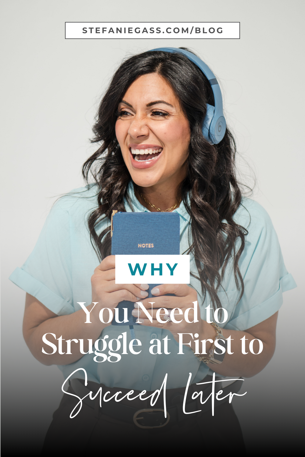 A brunette woman smiling looking to the side while holding a blue notebook. She also has blue headphones on. Her blouse is light blue. She's also wearing black pants. The title of the image is: Ep-806-Why-You-Need-to-Struggle-at-First-to-Succeed-Later-Stefanie-Gass-Branded