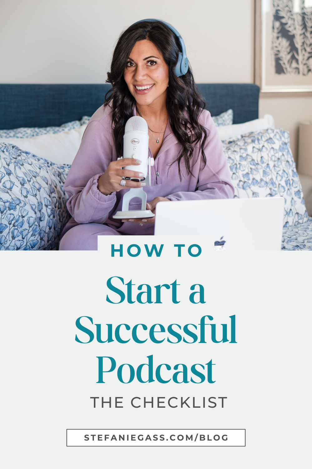 Graphic of a dark-haired woman wearing a lilac sweater and sweatpants, with blue headphones, and a white Yeti microphone. She's sitting on the bed and has her laptop in front of her. The image title is: How-to-Start-a-Successful-Podcast-The-Checklist-Stefanie-Gass-Branded