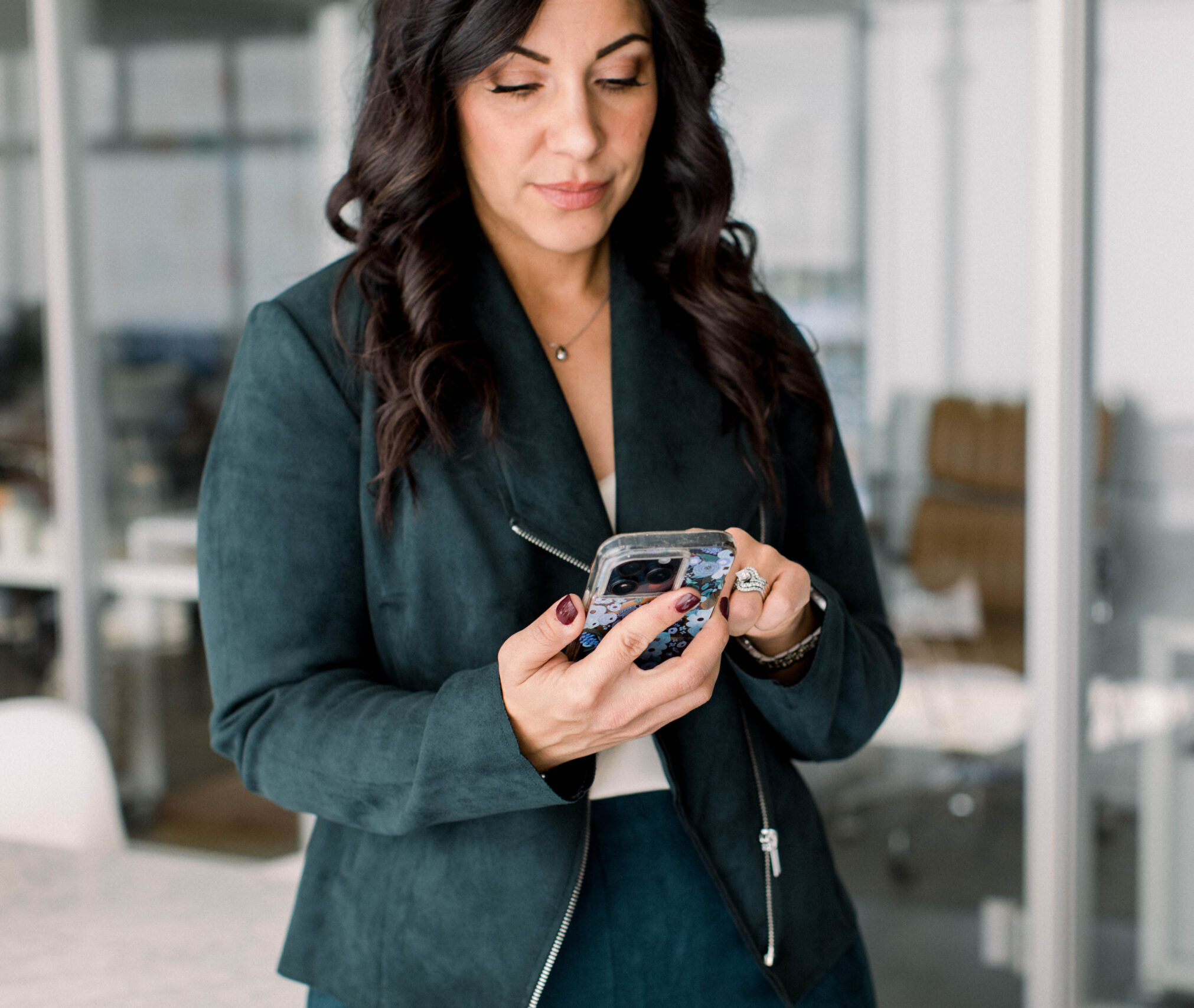 phone-in-hand-serious-face-in-office-stefanie-gass image title is: Increase-Your-Attention-Span-And-Focus-With-This-Method-Stefanie-Gass