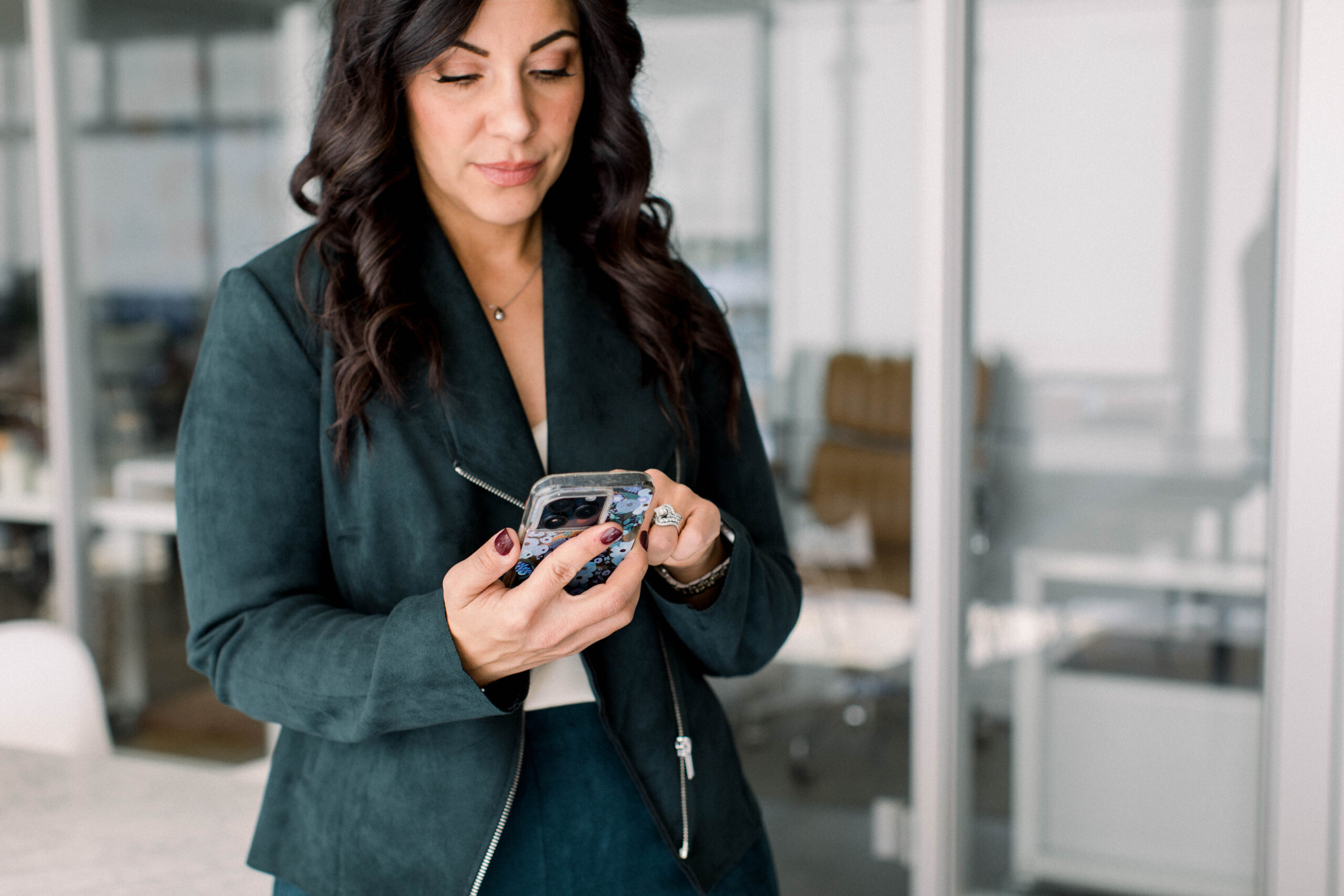 phone-in-hand-serious-face-in-office-stefanie-gass image title is: Increase-Your-Attention-Span-And-Focus-With-This-Method-Stefanie-Gass